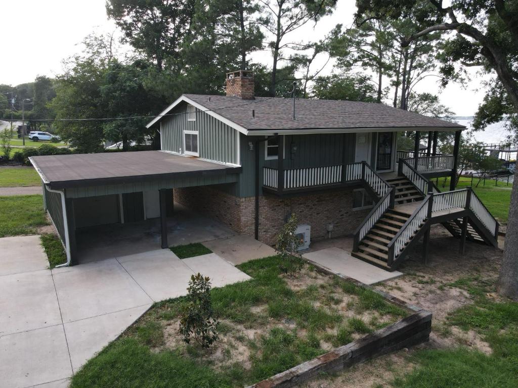a small house with a staircase in a yard at Lakeview Lookout in Tool
