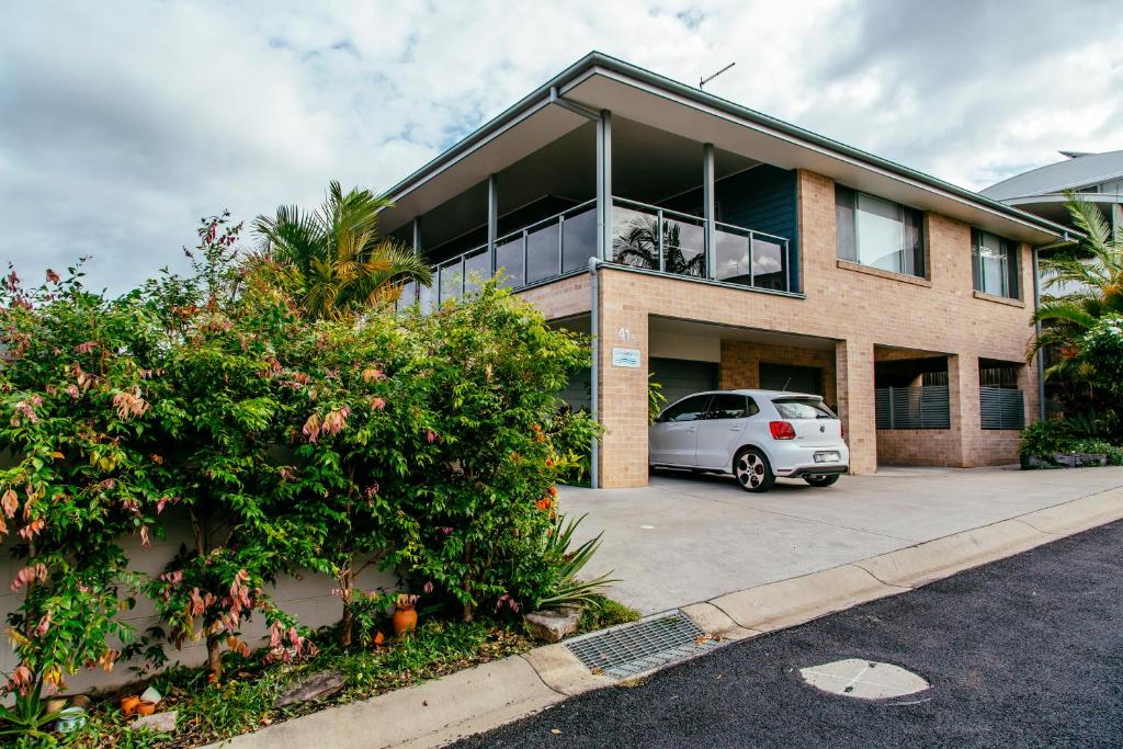a house with a car parked in front of it at Coffs Jetty BnB in Coffs Harbour