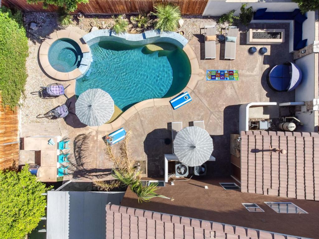 an overhead view of a pool at a resort at NEWGamesTVsHeated PoolFirepitFireplace in Coachella