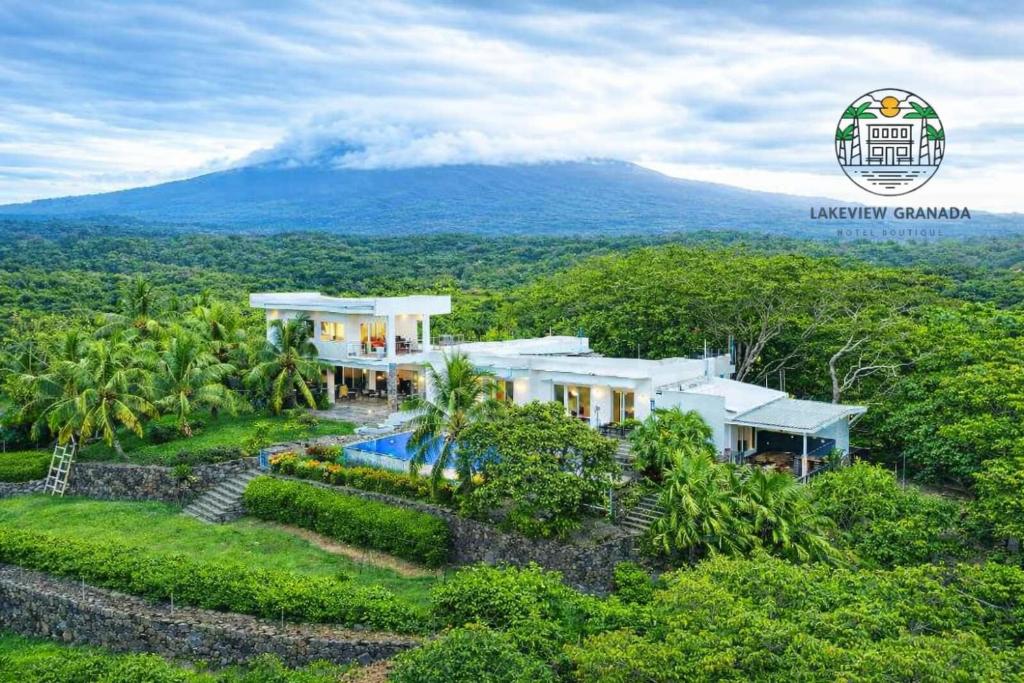 an aerial view of a house with a mountain in the background at Lakeview Granada Hotel Boutique in Granada