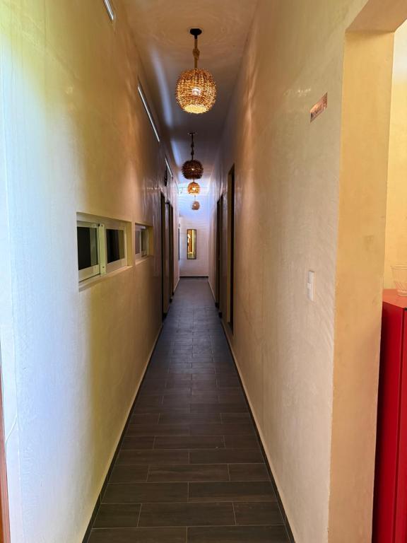 a long hallway with a long hallway sidx sidx at Casa Faustos in Mérida