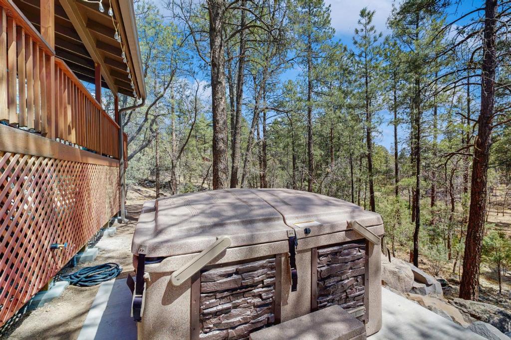 a large suitcase sitting on the porch of a house at Wild West Wonder in Pinetop-Lakeside