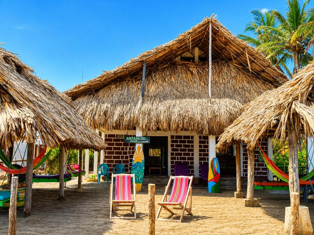 a resort with chairs and straw umbrellas on the beach at Antara del Mar in San Bernardo del Viento