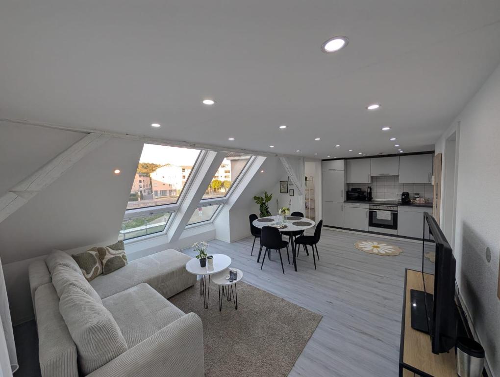 a living room with a couch and a table at Lovely Home For You 2 in Biberach an der Riß