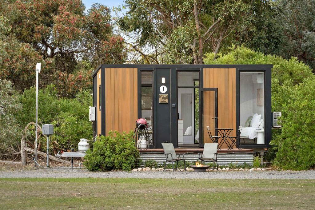 a tiny house on display in a garden at Halls Haven Tiny House 2 by Tiny Away in Halls Gap
