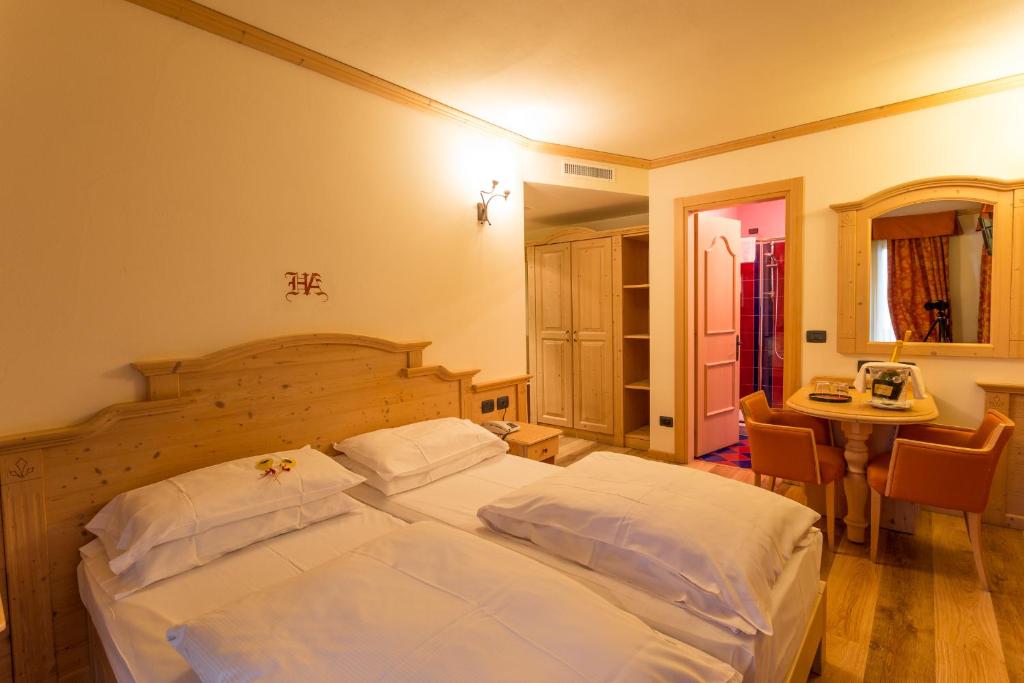 Postel nebo postele na pokoji v ubytování Hotel Arisch