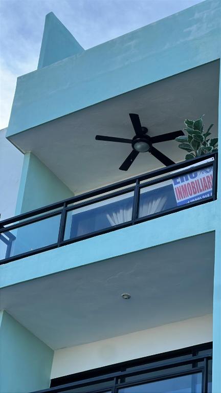 a clock on the side of a building at Dominican paradise in Punta Cana