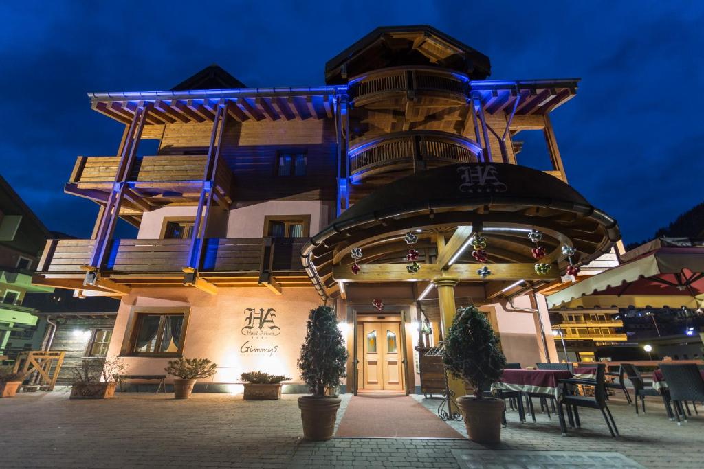 a building with blue lights on top of it at Hotel Arisch in Aprica