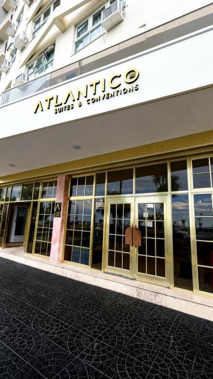 an entrance to an apartment building with glass doors at Hotel Atlántico Suites in Mar del Plata