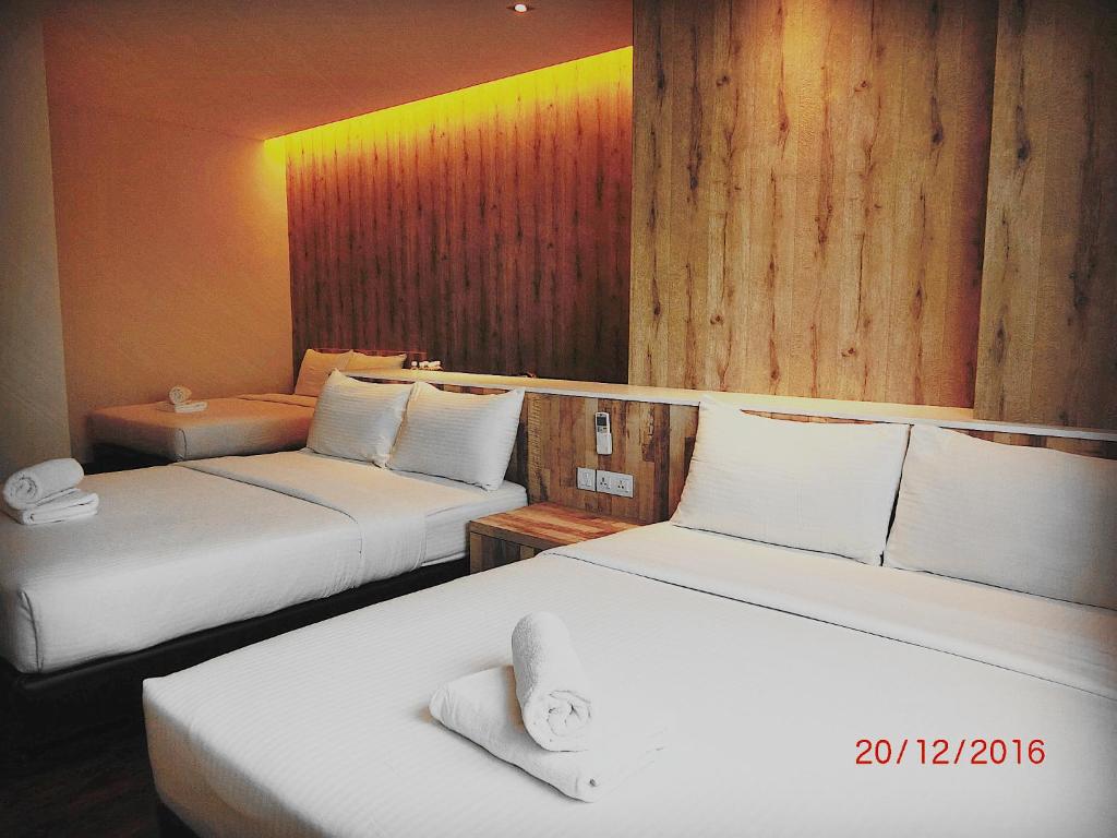 Postel nebo postele na pokoji v ubytování D Elegance Hotel
