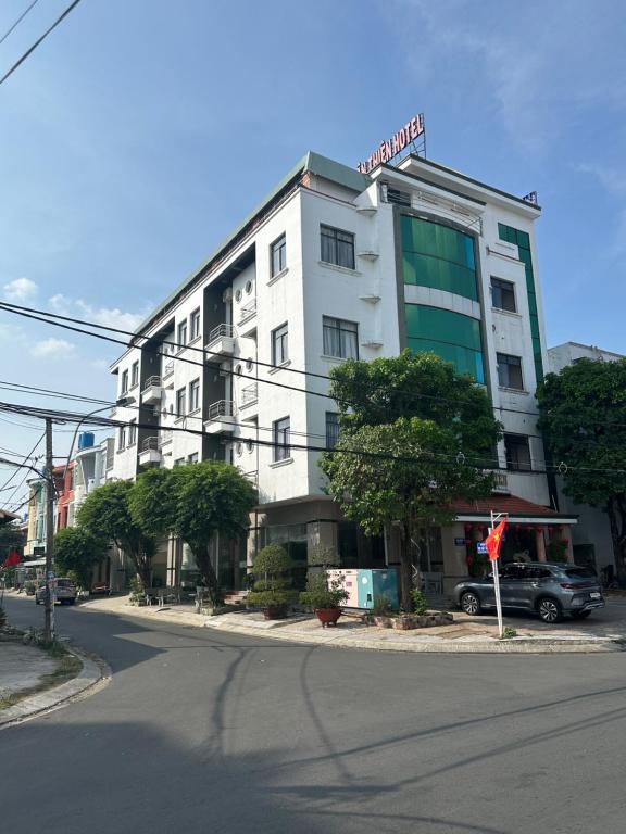 a white building on the side of a street at SEAMOON Hotel in Rạch Giá