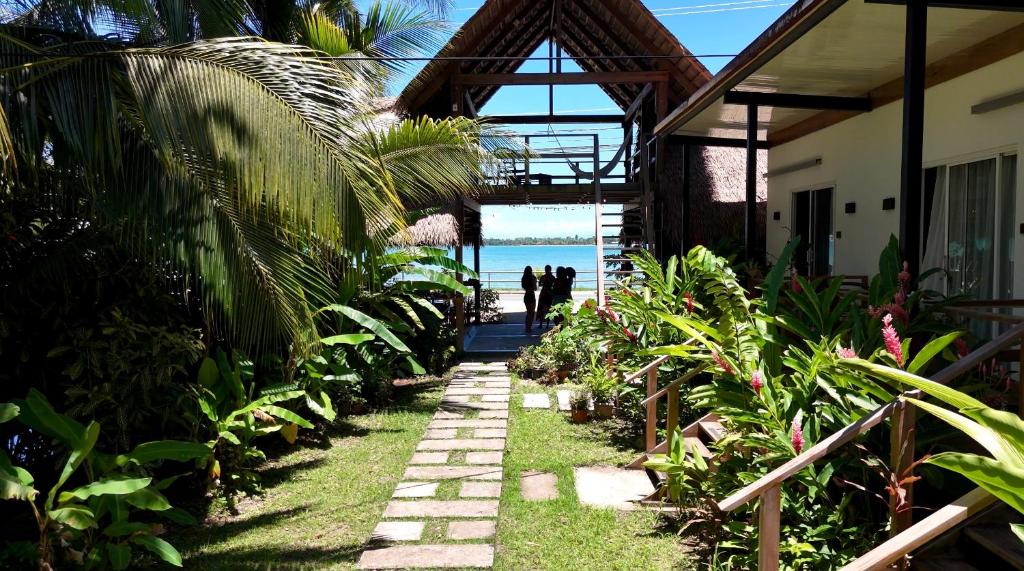 a pathway leading to a house with a view of the ocean at Somewhere In Bocas in Bocas Town