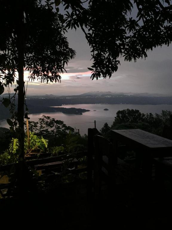 a view of a body of water at sunset at Cabañas La PetiteChef in El Limar