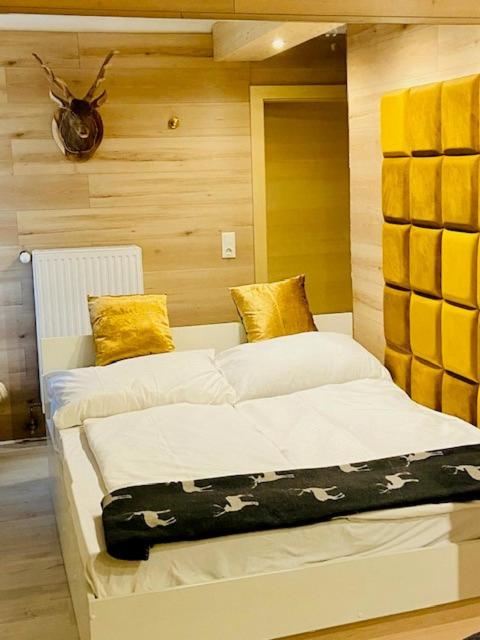 a bedroom with two beds in a room at Wilderer Suiten Mariazell in Mariazell