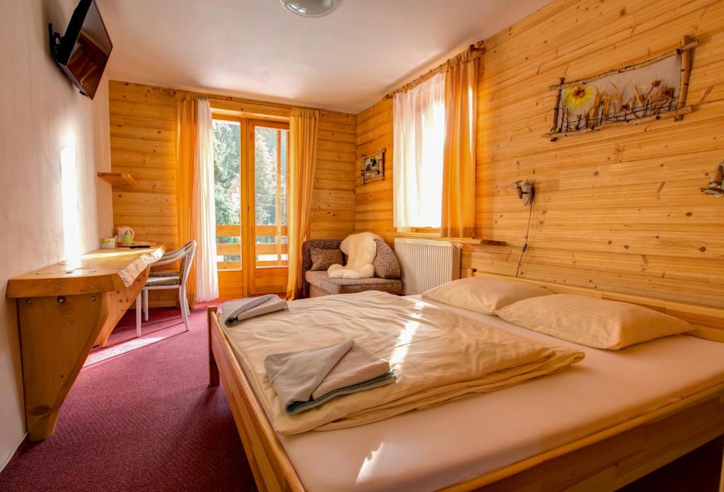 Postel nebo postele na pokoji v ubytování Penzion Limba