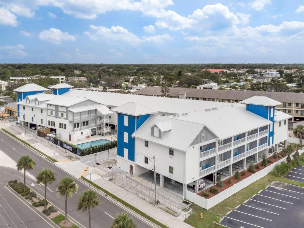 an aerial view of a large white building with blue accents at The J Hotel Dunedin Clearwater, an Ascend Collection Hotel in Dunedin