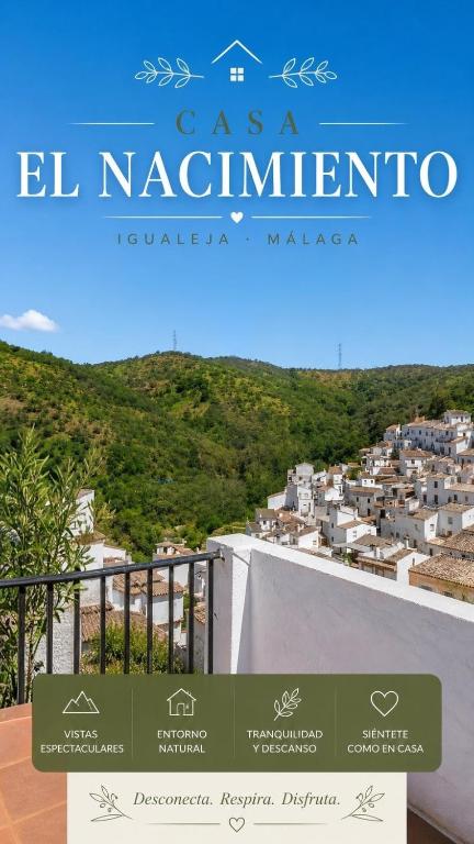 a sign for a hotel in positano with a view of a city at casa el nacimiento in Igualeja