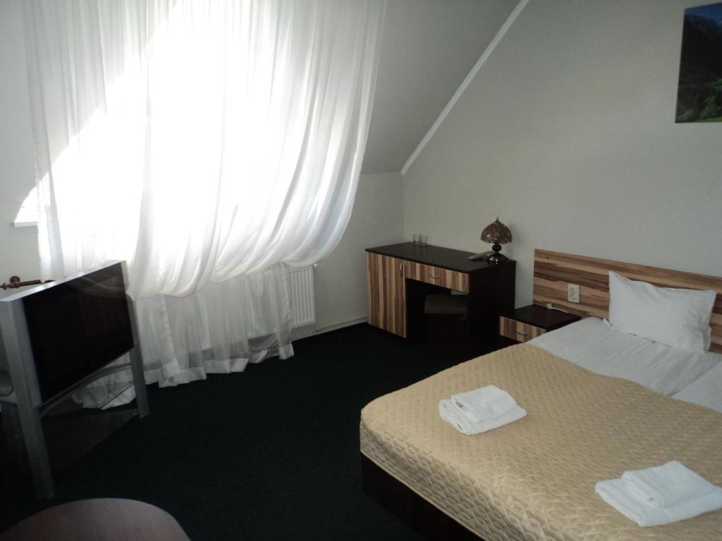 Katil atau katil-katil dalam bilik di Hotel Restaurant Vizit