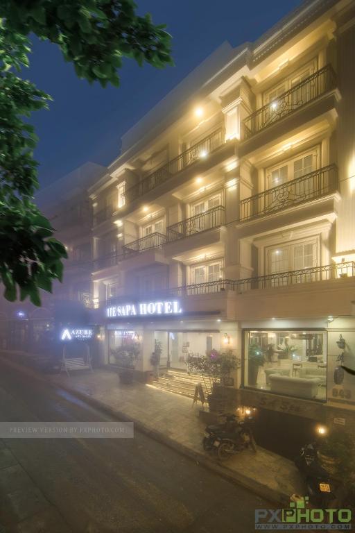 a building with a hotel on a foggy night at Sapa Signature Inn in Sapa