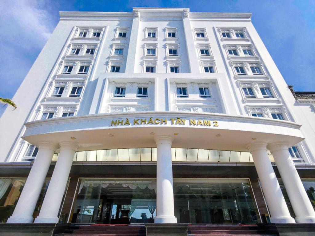 a large white building with a sign on it at Tây Nam 2 Hotel in Can Tho