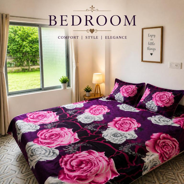 a bedroom with a bed with pink roses on it at Laxmi Narasimha homestay in mayapur