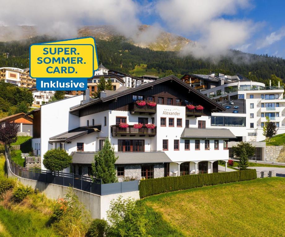 a building with a sign that reads super summer camp at Appartements Alexander in Fiss