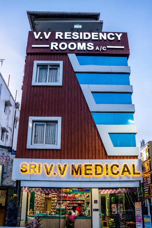 a red building with a sign that readsrw medical at V V Residency in Thanjāvūr