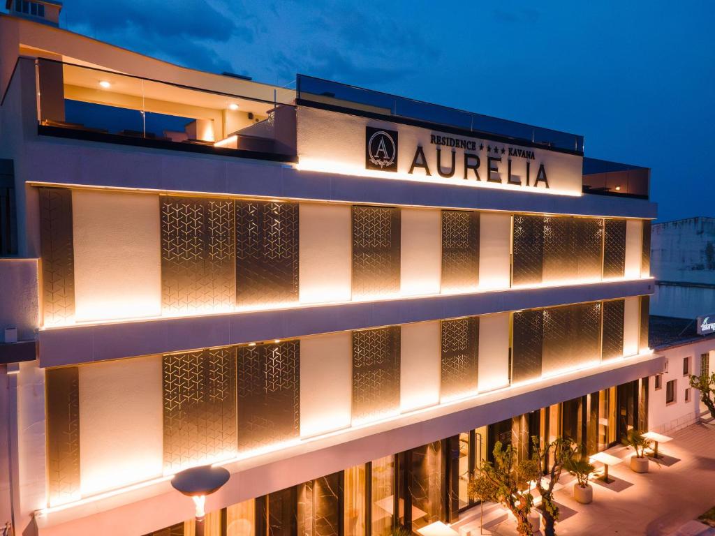 a building with lights on the side of it at Aurelia Residence in Metković