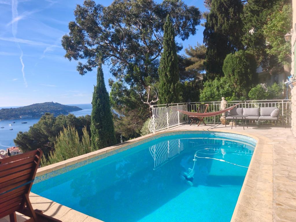 a swimming pool with a view of the water at Studio with private pool in Villefranche-sur-Mer