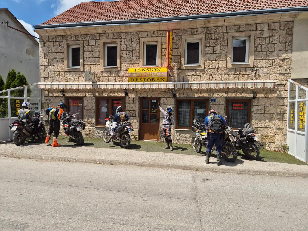 a group of motorcycles parked in front of a building at Soba za goste Kraljica 3 in Kupres