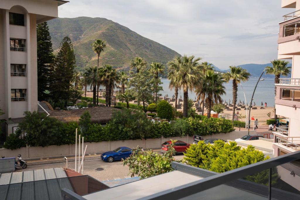 a view of the beach from a balcony of a building at Beach Suites İçmeler Marmaris in İçmeler