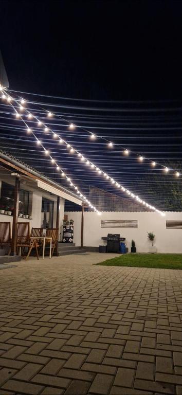 a group of lights on a building with a patio at Casa Alice in Săcele