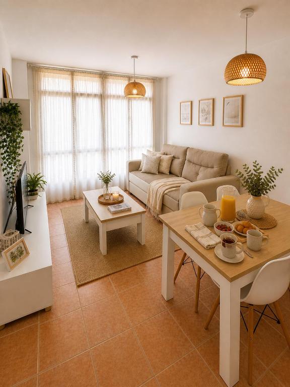 a living room with a couch and a table at Alojamiento Ultreia - Estorde in Cee