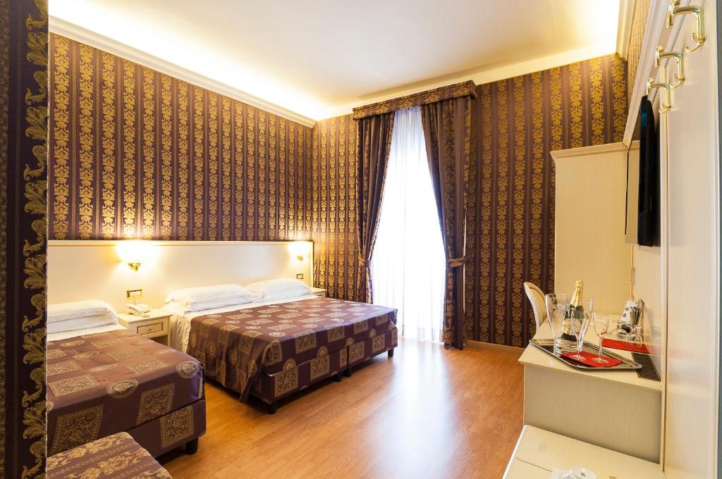 Postel nebo postele na pokoji v ubytování Trevi 41 Hotel