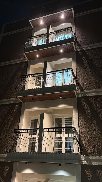 a building with balconies on the side of it at Zenia IT Rooms in Pune