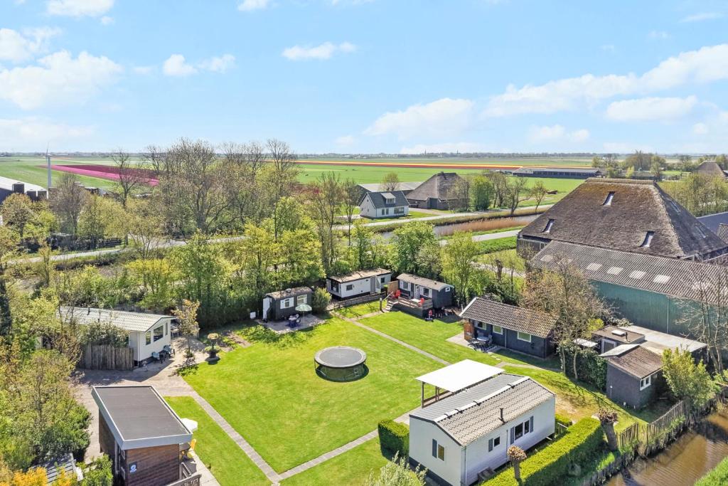 an aerial view of a home with a yard at Camping Oudesluis in Oudesluis