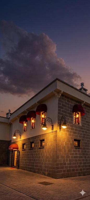 a building with lights in the windows at night at Grand Sur Butik Otel in Diyarbakır