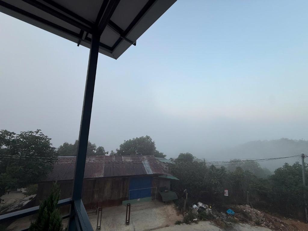 a house on a hill with a view of a valley at Mây HomeStay in Da Lat