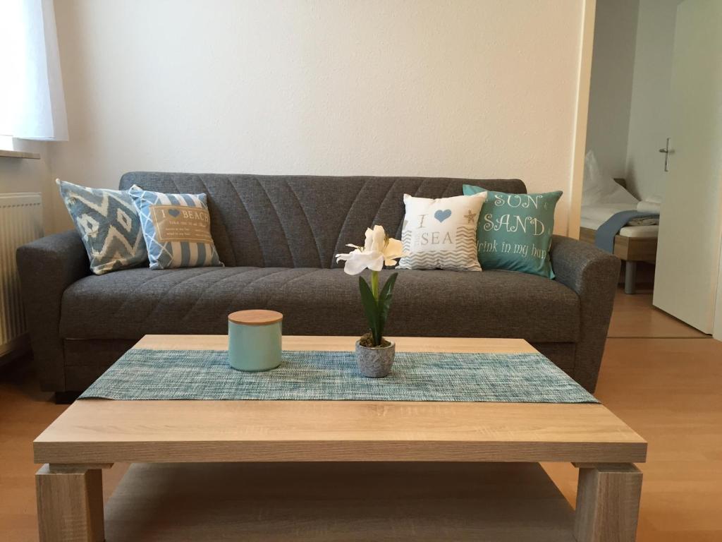 a living room with a couch and a coffee table at havenhome Bremerhaven in Bremerhaven