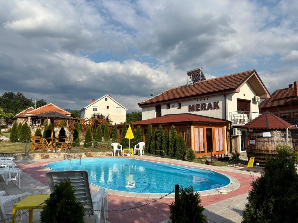 a large swimming pool in front of a house at MERAK STD in Vranje