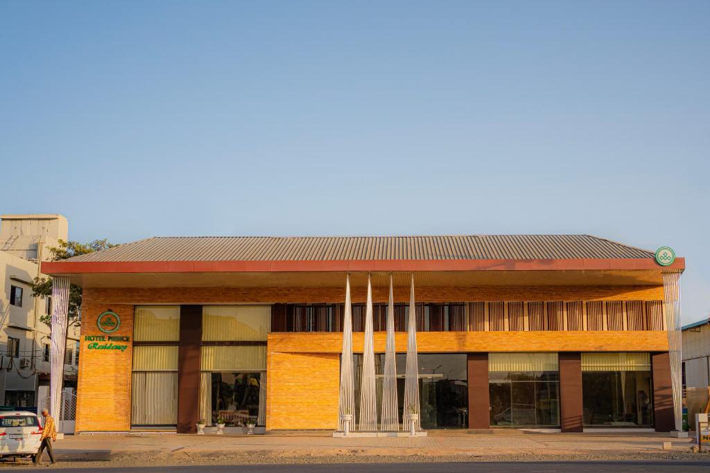 a building with a clock on top of it at Hotel Prince Residency, Bhuj in Bhuj