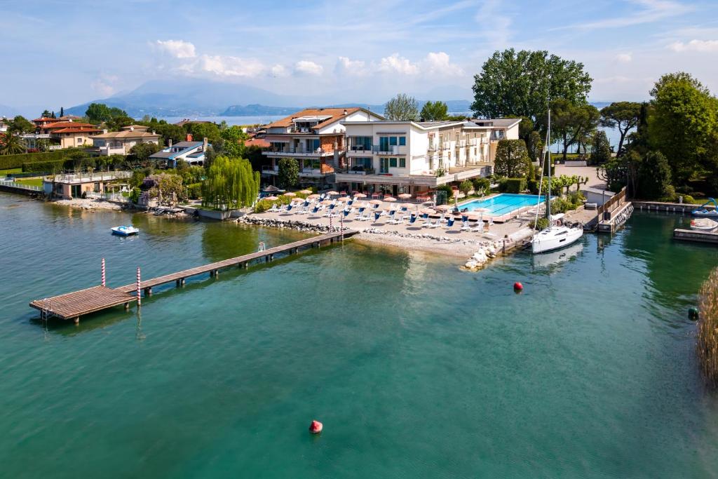 an aerial view of a marina with boats in the water at Hotel Tre Vele in Sirmione