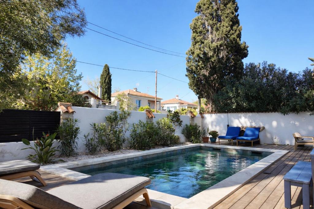 a swimming pool in the backyard of a house at Lis Oureto in Saint-Cyr-sur-Mer
