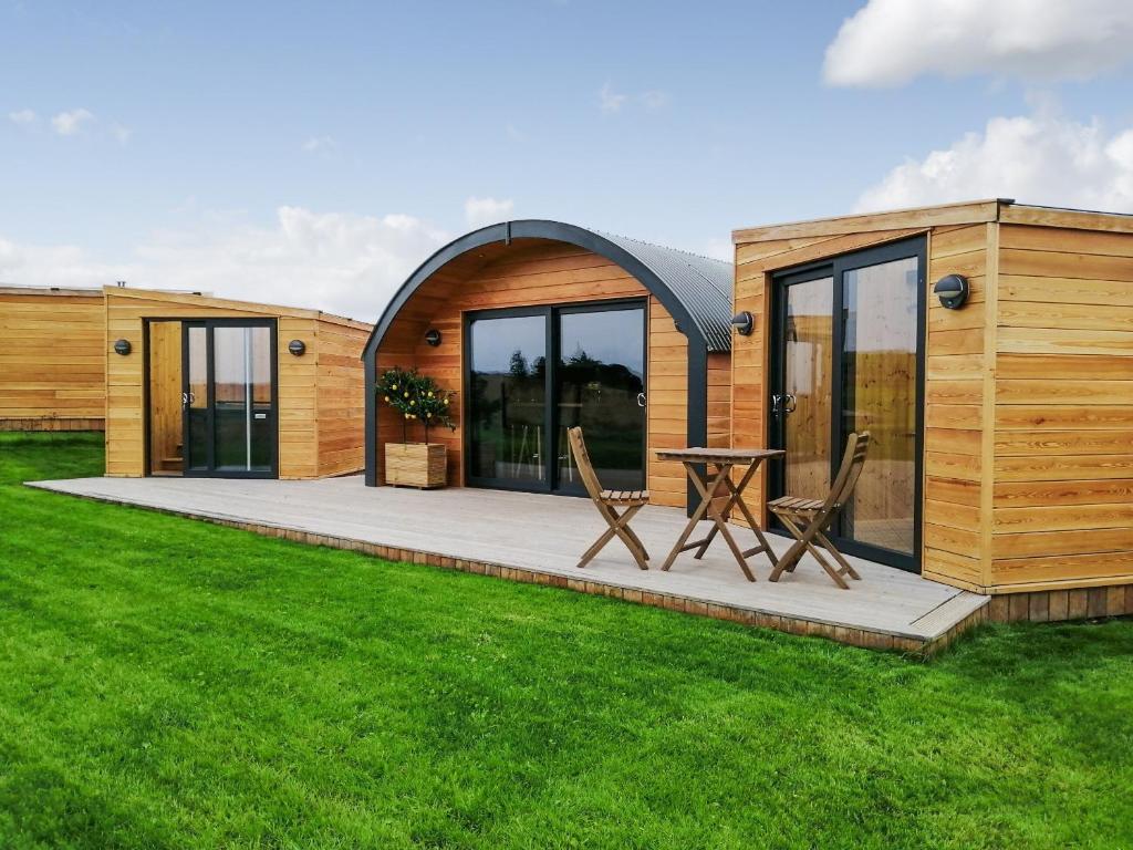 a modular home with a patio and grass at Ben Aigan - Ukc6027 in Newmill