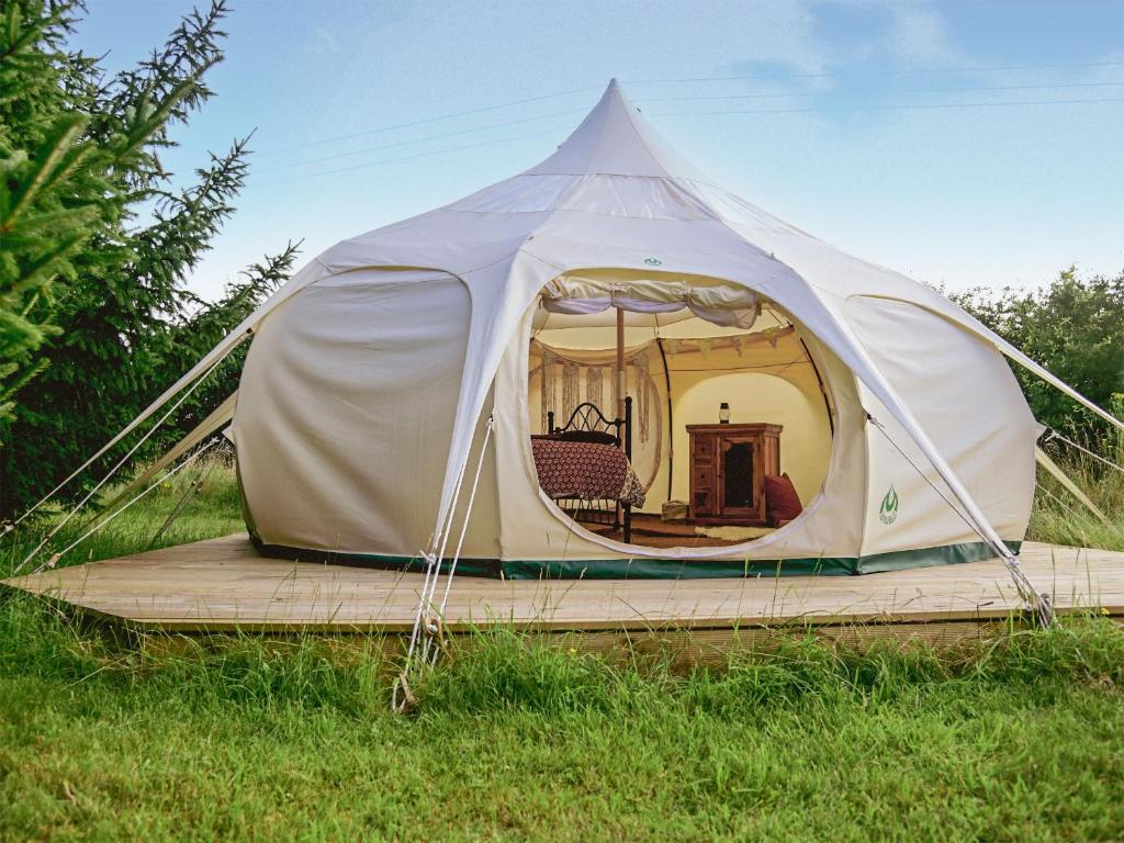 a white tent sitting in a field of grass at Shepherds Belle & Croft Hut - Qu7633 in Messing