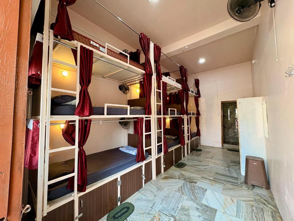 a room with a bunch of bunk beds in it at 5 Star Yatri Vishram AC & Non AC Dormitory in Jabalpur