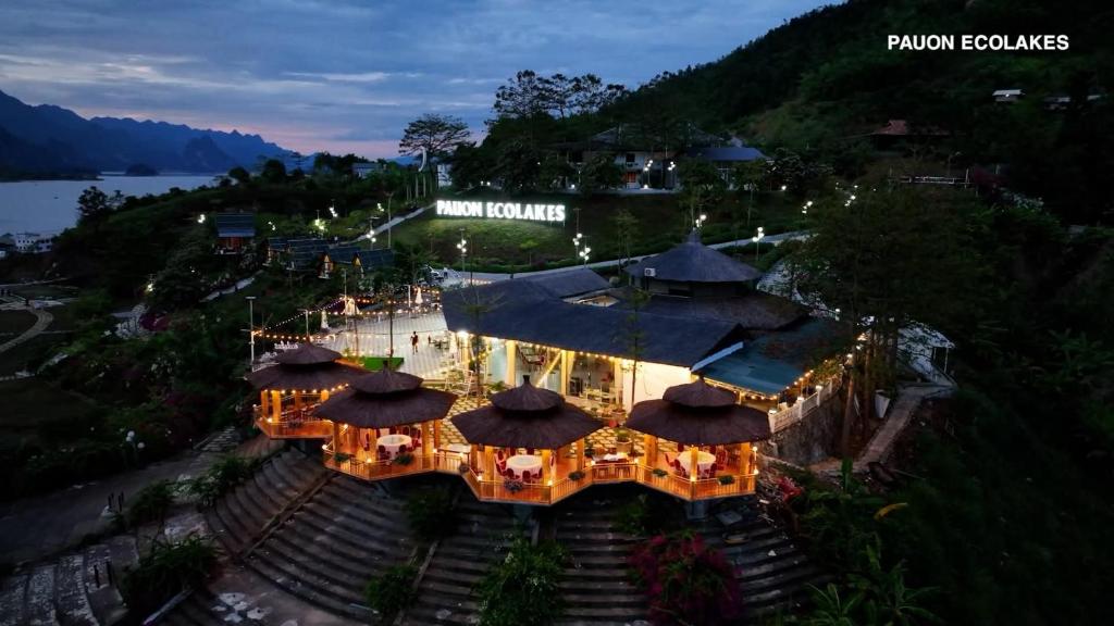 an aerial view of a restaurant with tables and umbrellas at KDL Pauon Ecolakes in Quỳnh Nhai