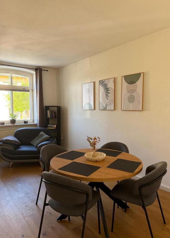 a living room with a table and chairs at Dianas Ferienwohnung 2 in Feldberg
