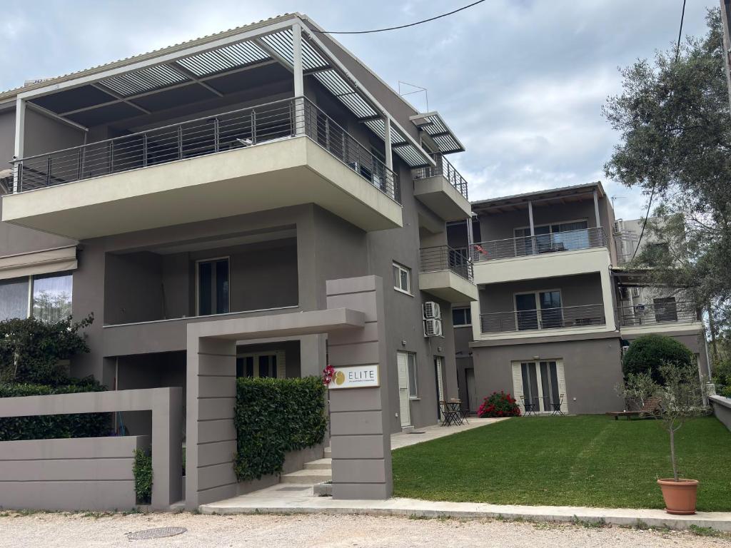 an image of an apartment building with a yard at Elite City Apartments & Maisonettes in Lefkada