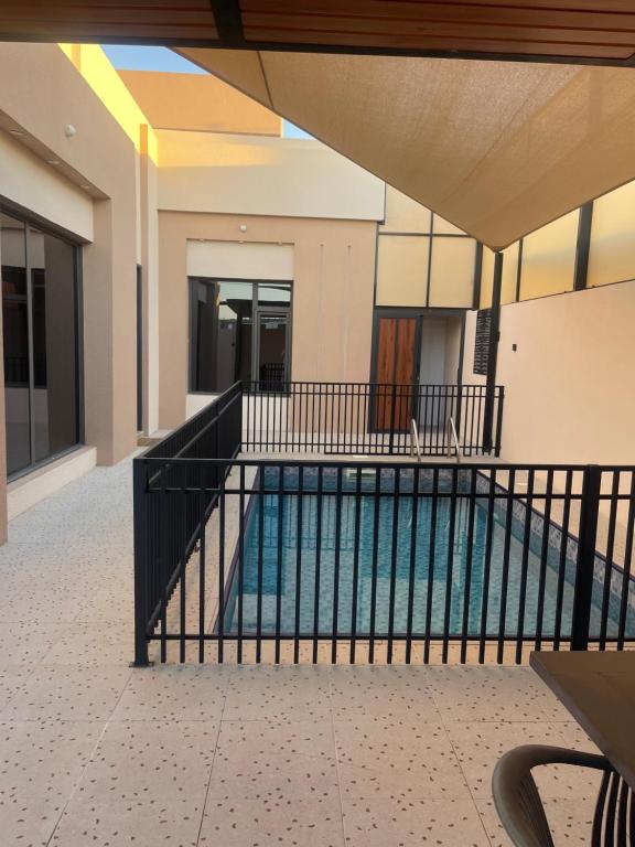 a swimming pool inside of a building at AL Rabie Resort ,Nizwa Grand Mall in Firq